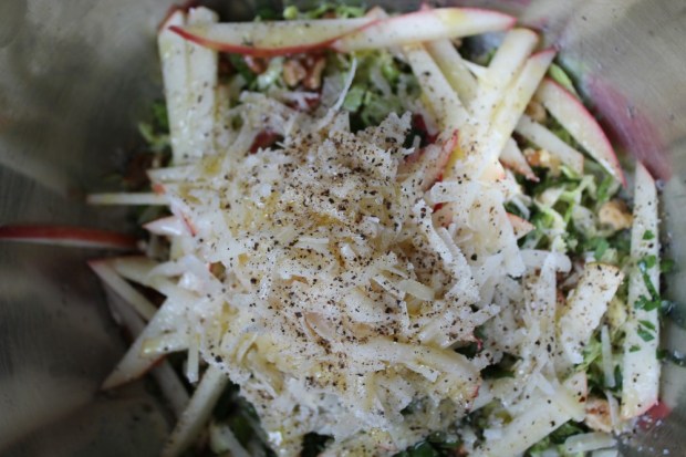 To the sprouts, add matchstick slices of Pink Lady apple, toasted walnuts, chopped Italian parsley, grated Parmesan Reggiano, salt, cracked black pepper, fresh lemon juice and EVOO. 