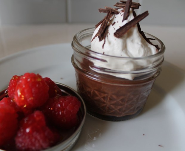 For service, add a dollop of whipped cream, shaved chocolate and some fresh raspberries or strawberries on the side. Place the fruit in the jar lids and drizzle some orange blossom honey over the top.